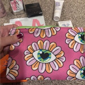 Assorted hair and beauty products w makeup bag from color wow ciate and redken